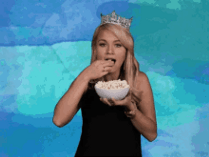 Lady With Tiara Eating Popcorn GIF