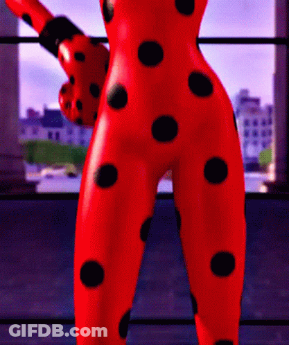 Ladybug Statue With Black Polka Dots On Pants GIF
