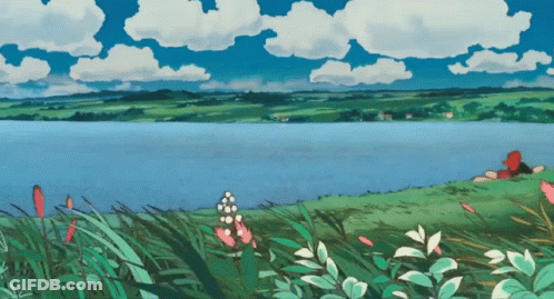 Lake With Person Laying On Shore GIF