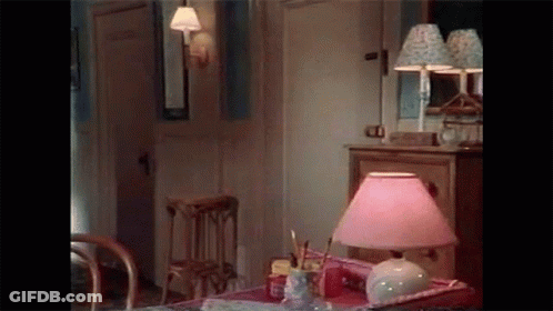 Lamp With Pink Shade On Table GIF