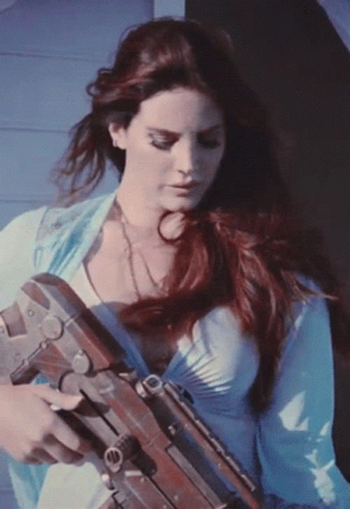 Lana Del Rey Holding A Gun GIF