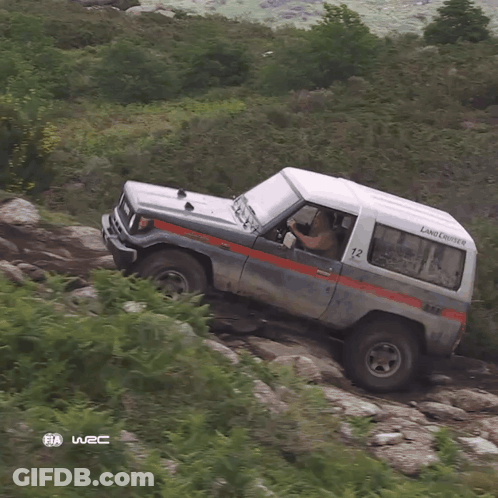 Land Cruiser Parked On Rocky Hillside GIF