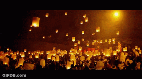 Lanterns Thrown Into Air At Night GIF