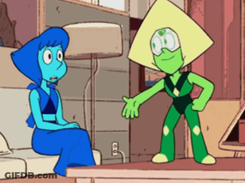 Lapis Lazuli And Peridot Are Sitting On A Couch Talking To Each Other . GIF