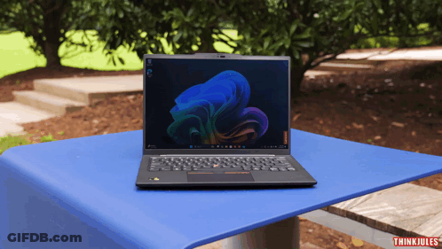 Laptop On Blue Table With Thinkjules GIF