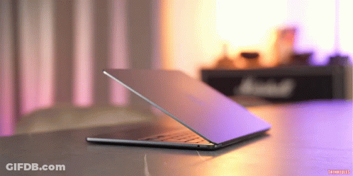 Laptop On Purple Background With Marshall Sign GIF