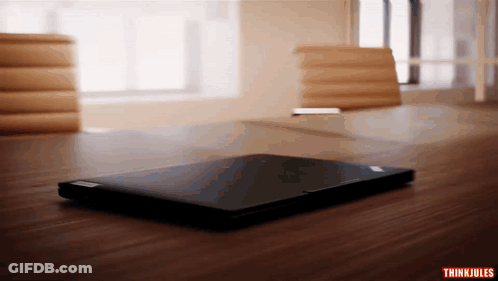 Laptop On Wooden Table With Thinkjules GIF