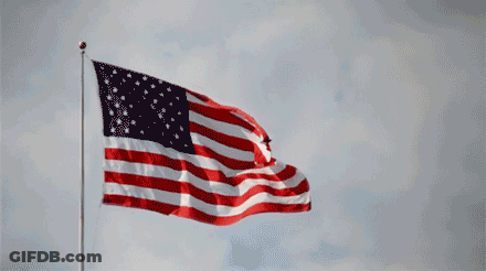 Large American Flag Flying In Wind GIF