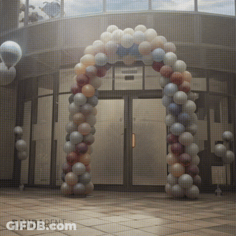 Large Balloon Arch In Front Of Building Saying Randarent GIF