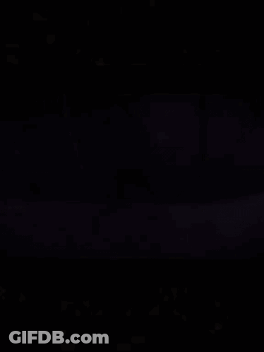 Large Bell Hanging From Rope Over Water GIF