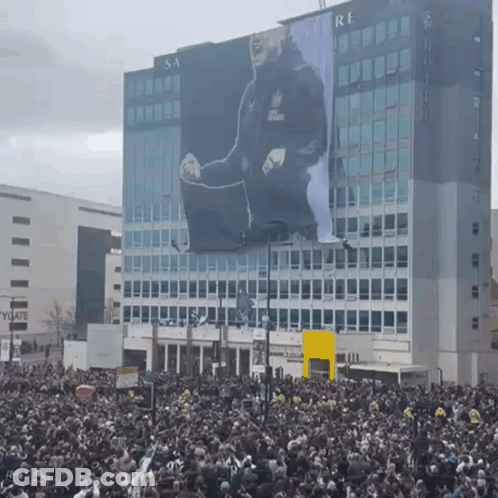 Large Billboard With Man Saying Re GIF