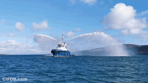 Large Blue And White Boat Spraying Water GIF