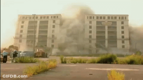 Large Building Demolished With Smoke GIF