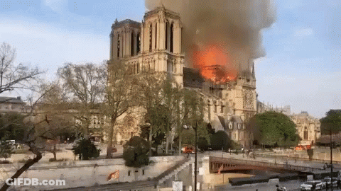 Large Building On Fire With Smoke GIF