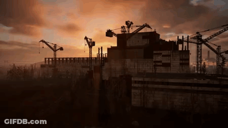 Large Building Under Construction With Cranes At Sunset GIF
