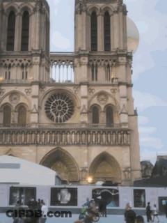 Large Building With Clock And Many Windows GIF