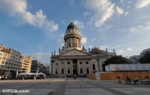 Large Building With Dome And Statue On Top GIF