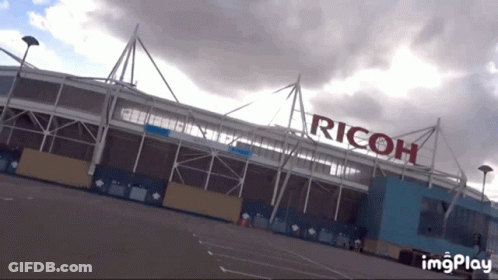 Large Building With Ricoh GIF