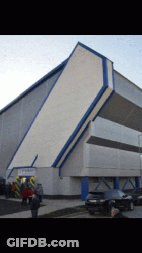 Large Building With Stadium Sign GIF