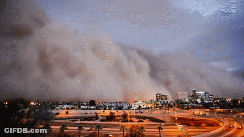 Large Cloud Of Smoke Over City GIF