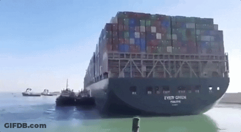 Large Container Ship Towed By Tug Boat GIF