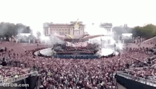 Large Crowd Gathered In Front Of Building GIF