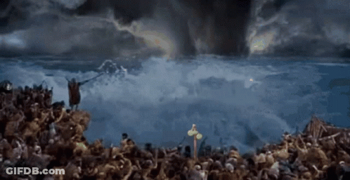 Large Crowd In Field With Cross GIF