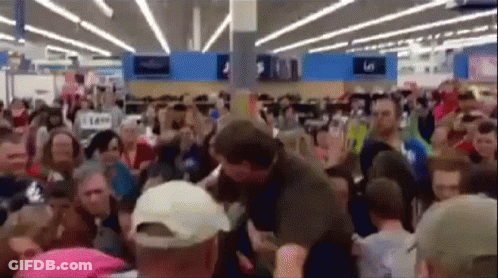 Large Crowd In Store With 5 Sign GIF