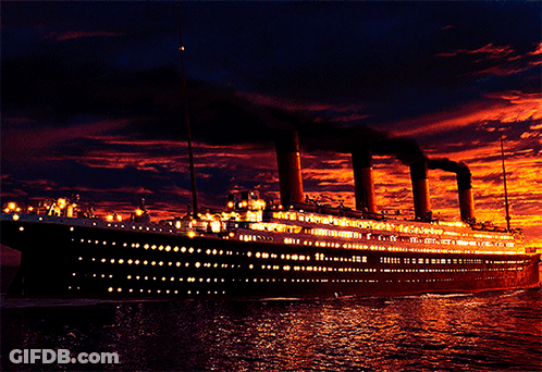 Large Cruise Ship Floating On Water At Sunset GIF