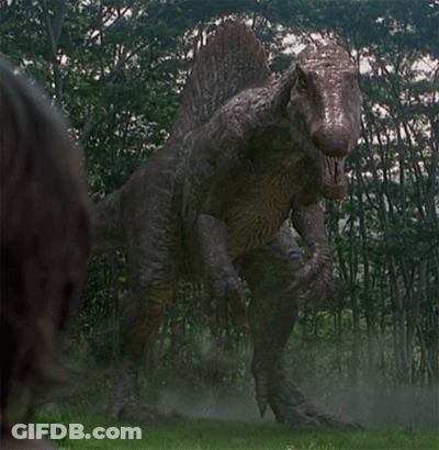 Large Dinosaur Standing In Grass GIF