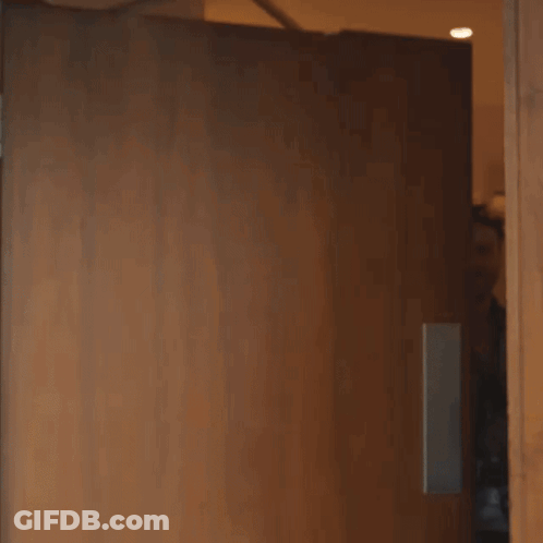Large Explosion Behind Fence In Parking Lot GIF