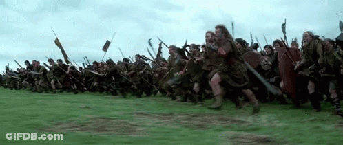 Large Group Of Soldiers Marching Through Field GIF