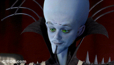 Large Headed Green Eyed Cartoon Character Staring Camera GIF