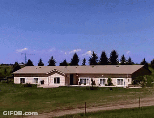Large House In Grassy Field GIF