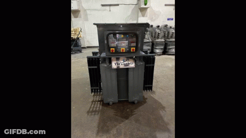 Large Machine Beside Blue Barrel Saying Petronas GIF