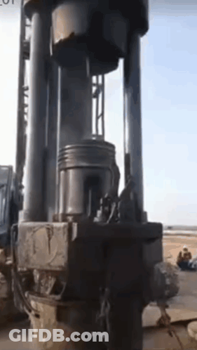 Large Machine On Rocks In Field GIF