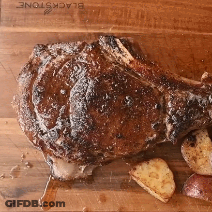 Large Meat On Cutting Board With Potatoes GIF