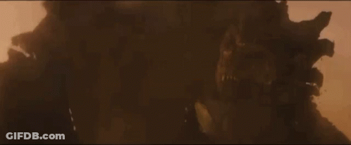 Large Monster Standing In Desert Covered In Dust GIF