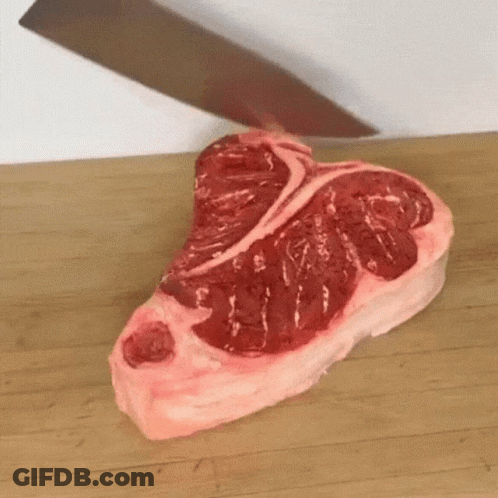 Large Piece Of Meat Being Cut On Cutting Board GIF