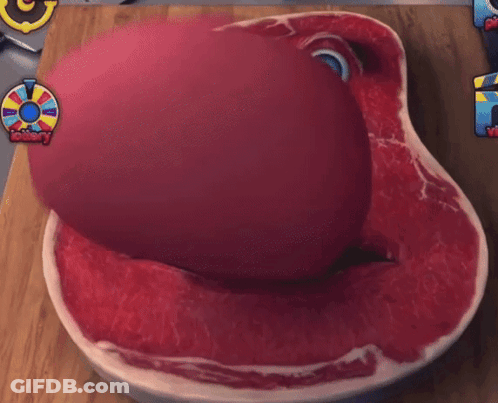 Large Piece Of Meat With Face On Cutting Board GIF