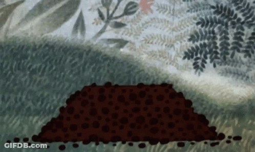 Large Pile Of Dirt In Grass GIF