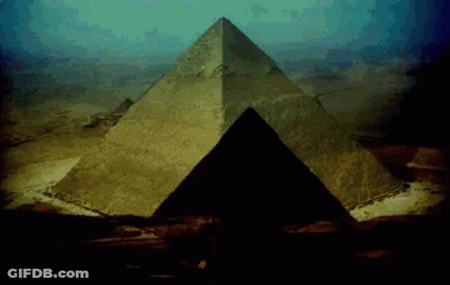 Large Pyramid In Desert With Blue Sky GIF