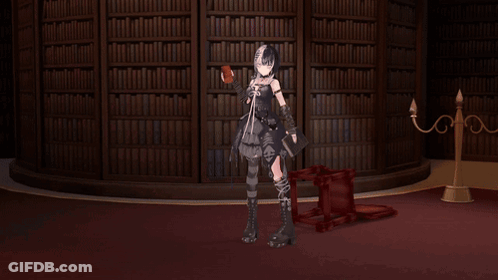 Large Red Cube On Table In Front Of Library GIF