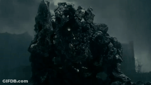 Large Rock With Lights In Dark GIF