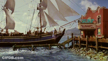Large Sailboat Docked At Surf Shop GIF