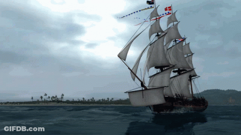 Large Sailboat Floating In Ocean With Island In Distance GIF