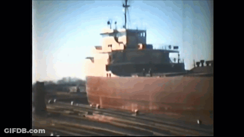 Large Ship Docked With People GIF