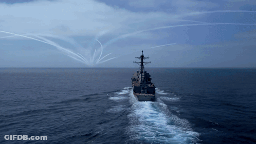 Large Ship Floating In Ocean With Smoke Trails GIF