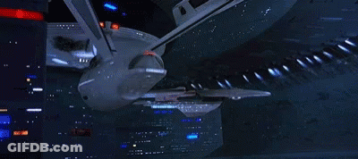 Large Space Ship Flying Through Space GIF