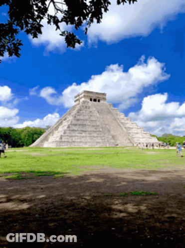 Large Stone Pyramid Blue Sky White Clouds GIF
